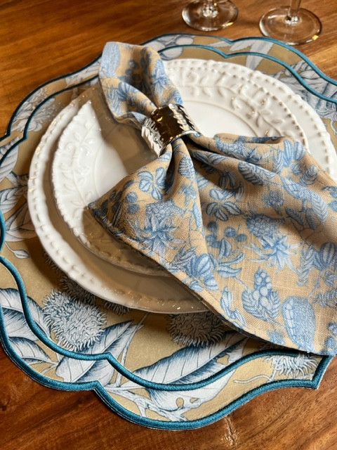 Luxury designer round placemats by Iza Silva in tan and blue