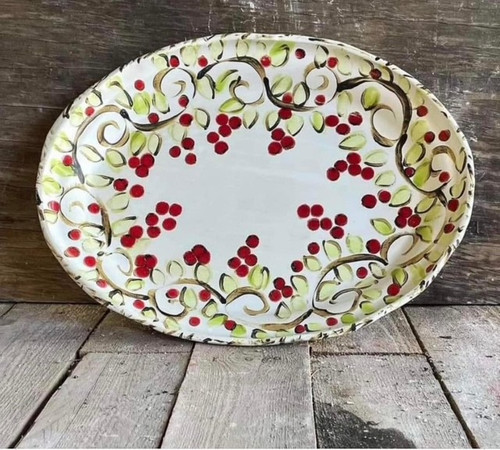 Handcrafted ceramic Christmas Berry/tomato Ruffle Tray by artisan Kim Stone at Mockingbird Pottery. This lovely piece features hand-painted berries and ruffle edges. Microwave and dishwasher safe- perfect for holiday entertaining.