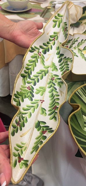Carole Shiber Hollyberry Sculpt Table Peapod Basket featuring hand-painted green holly leaves, red berries, gold accents, and a gold underside, available at Pine Apple Mercantile Company. pine-apple-mercantile-company-carole-shiber-hollyberry-sculpt-table-peapod-basket.jpg