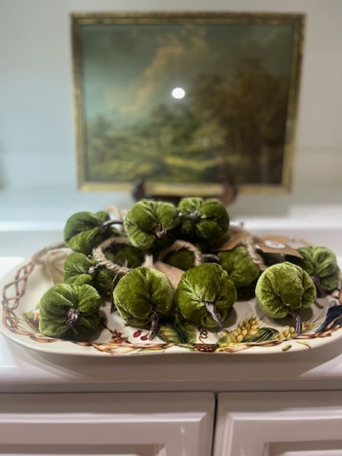 Green velvet pumpkin napkin rings adding Southern charm to any fall table setting.