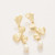 The Spartina 449 Ginko Leaf Dangle Earrings feature hammered 18kt. matte gold plated leaves accented with freshwater pearls for a timeless, elegant look. A classic 2.25-inch statement earring perfect for all year-round wear.