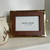 Elegant gold trimmed leather 4x6 picture frame with rich leather finish and adjustable gold metal stand, designed for tabletop display of family photos, wedding portraits, and keepsakes; timeless luxury home décor frame for shelves, desks, and bedside tables.