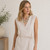 The Este Necklace features luminous freshwater pearls, pastel glass beads, and vintage-inspired 14k gold-plated accents in a handcrafted multi-strand design. This elegant statement necklace blends coastal charm with timeless sophistication, making it the perfect accessory for weddings, special occasions, and elevated everyday