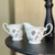 Vintage Noritake Rosamor cream and sugar set featuring white porcelain with black floral detailing and platinum trim, including creamer and sugar bowl without lid, discontinued collectible china made in Japan.