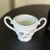 Vintage Noritake Rosamor cream and sugar set featuring white porcelain with black floral detailing and platinum trim, including creamer and sugar bowl without lid, discontinued collectible china made in Japan.