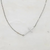 Kayla Side Cross Necklace in 18K gold-plated stainless steel featuring a delicate sideways cross on an adjustable chain.