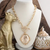 Gold horse scene toggle pendant necklace with chunky chain and oval scenic pendant