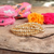 Gold beaded stretch bracelet stack featuring three polished gold-tone bracelets