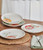 Introducing the Meadow Collection by Fitz and Floyd! Our Set of 4 Assorted Party Plates brings spring's charm to your table with vibrant flowers and perched birds. Crafted from durable earthenware, these plates are perfect for any occasion. Dishwasher and microwave safe. Dimensions: approx. 8.25" dia. x 1" H.