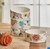 Elevate your dining experience with the Fitz and Floyd Floral Snack Bowls Set. Perfect for soups, chili, stews, and more, these bowls feature captivating floral designs on crisp white earthenware. Microwave and dishwasher safe for convenience. Shop now!