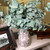 38.5” realistic faux eucalyptus stem with soft silvery-green leaves and natural veining, styled in a vase for elegant farmhouse home décor, lifelike artificial greenery for year-round arrangements and interior styling.