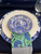 13" French blue floral charger plates featuring a vivid cobalt patter on white. Durable hard plastic design perfect for elegant blue and white tablescapes and timeless Southern entertaining.