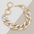Two toned gold and silver burnished chain bracelet with chunky interlocking linkks and round toggle clasp.