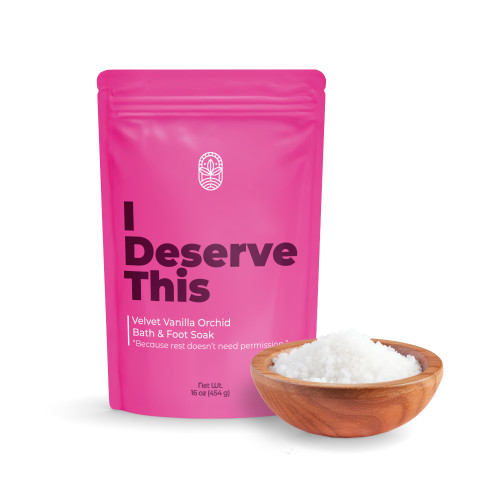 I Deserve This bath soak pouch with bowl of mineral bath salts on white background