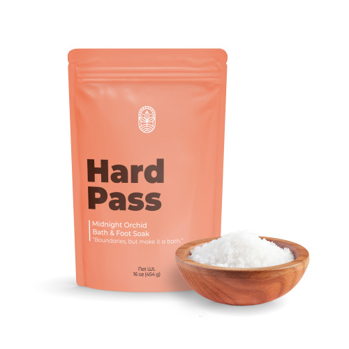 Hard Pass bath soak pouch with bowl of mineral bath salts on white background