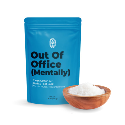 Out of Office bath soak pouch with bowl of mineral bath salts on white background