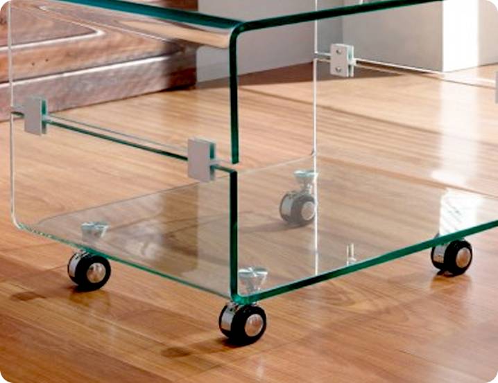 a glass table equipped with glass handling casters