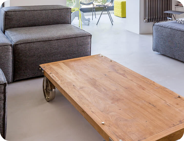 a small wooden table in a living room full of furniture