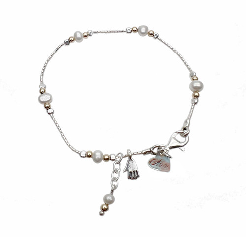 B00785 - PR - Pretty delicate bracelet with Pearls, gold beads and cute charm.