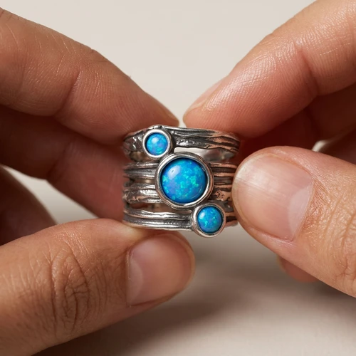 ASR346 - Classic Aviv Chunky ring with three round Opals 