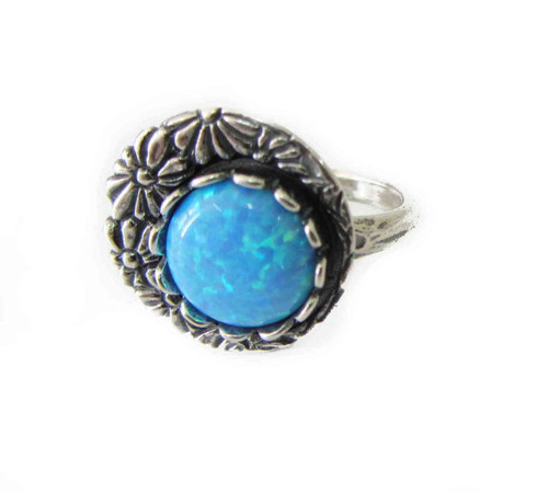 R02059 - Unique ring with spinning part with flower details and large round Opal