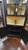 32" CORNER CUPBOARD W/GLASS TOP DOORS-LIGHT- DISTRESS FINISH/BUTTER CREAM/BLACK