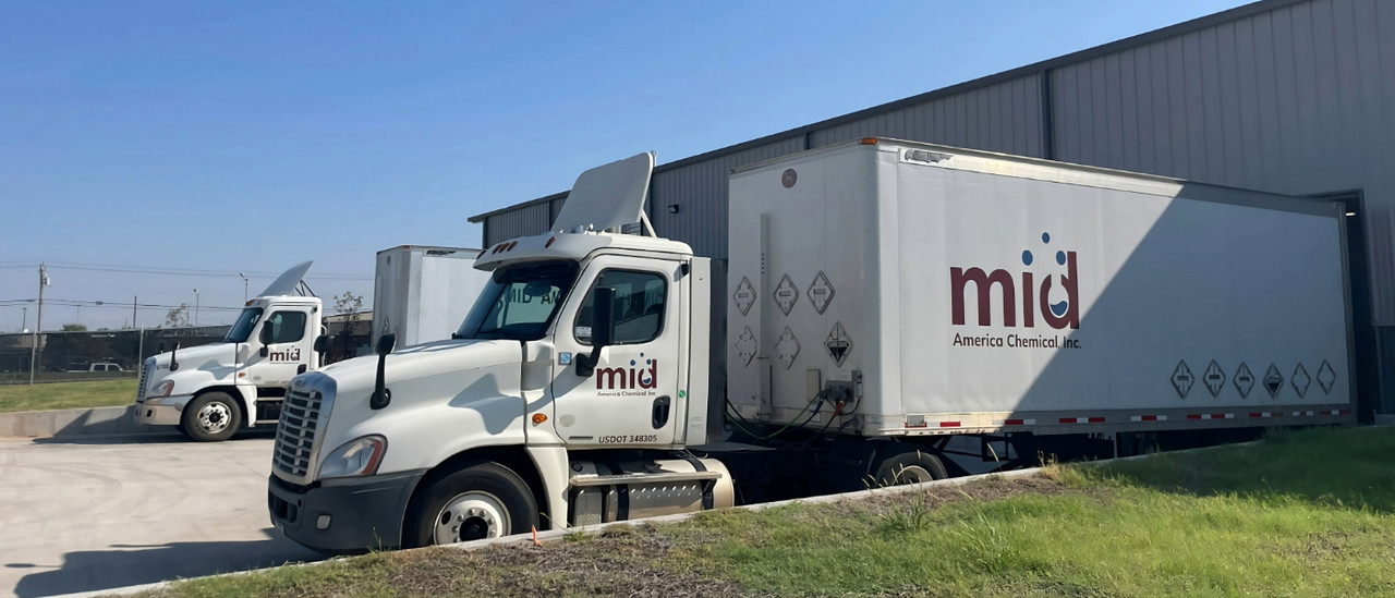 Dock crew loading pallets of chemicals onto box truck for nationwide delivery Dock crew loading pallets of chemicals onto box truck for nationwide delivery