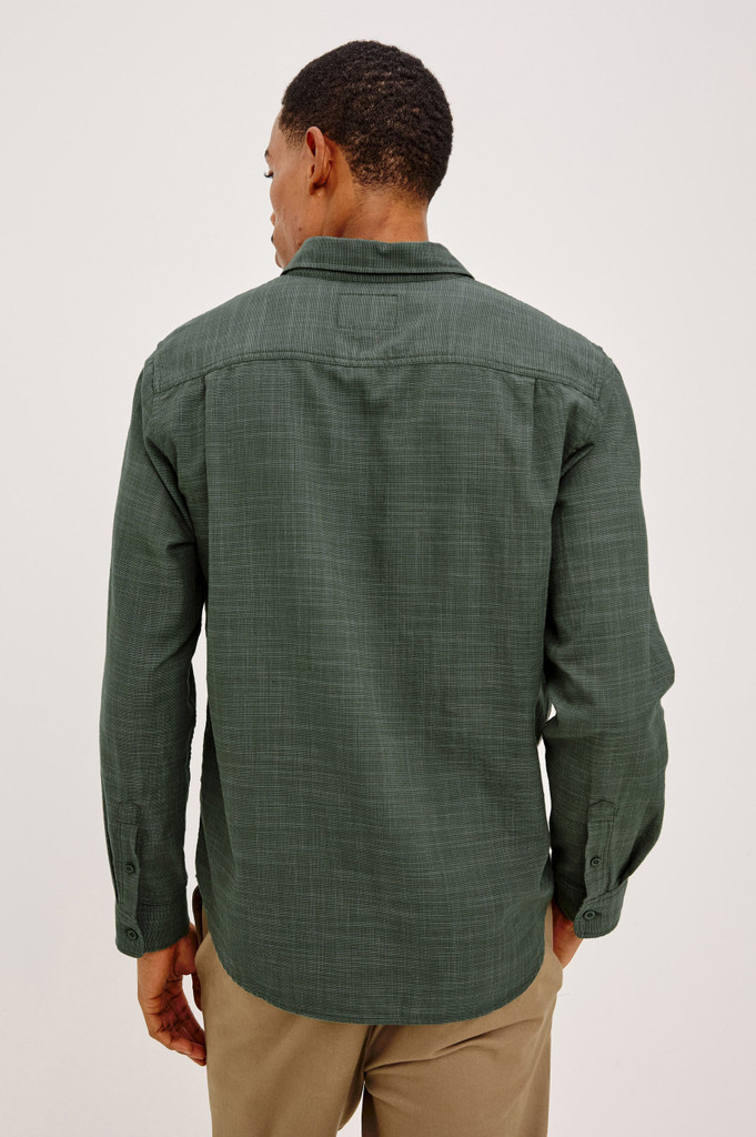Shop the men's Rails Wyatt Shirt in Pine Etch, a Southern California-inspired button-down. Crafted from 100% breathable, textured cotton slub, it features a relaxed fit, single chest pocket, and point collar. Perfect for effortless, smart-casual everyday wear.