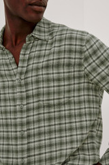 The Rails Lennox Shirt in Birch Forest is a best-selling, relaxed-fit men's plaid button-down. Crafted from a luxurious 55% cotton and 45% rayon blend, it is double-brushed on both sides for unmatched softness, featuring a classic spread collar, single chest pocket, and a curved shirttail hem.
