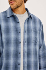 Shop the Rails Owens Shirt in Blue Mist Shadow, a lightweight 100% cotton gauze button-up. This relaxed-fit mens shirt features a soft herringbone texture, classic spread collar, chest patch pocket, and barrel cuffs, offering breathable, go-anywhere everyday style.