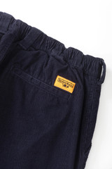Service Works corduroy waiter pants in navy blue.