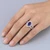 Pear Shaped Tanzanite and Diamond Halo Engagement Ring On Hand