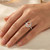 Oval Peach Pink Morganite and Diamond Halo Engagement Ring On Hand