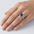 Oval Blue Sapphire and Diamond Halo Split Shank Statement Ring On Hand