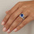 Cushion-Cut Blue Sapphire Diamond Halo Engagement Ring Set On Hand