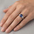 Oval Blue Sapphire Diamond 3 Stone Engagement Ring On Hand