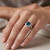 Cushion-Cut London Blue Topaz and Diamond Halo Statement Ring On Hand