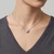 Scattered Diamond Heart Pendant Necklace On Model
