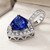 Triangular Tanzanite and Diamond Halo Pendant Necklace 14k Gold Side