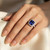 Large Cushion Tanzanite and Diamond Halo Statement Ring On Hand