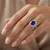 Cushion Cut Tanzanite and Diamond Halo Engagement / Statement Ring On Hand