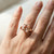 Cushion-Cut Peach Pink Morganite and Diamond Solitaire Ring On Hand