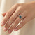 Blue Diamond Twisted Solitaire Engagement Ring On Hand