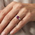 Purple-Pink and White Diamond Three Stone Engagement Ring On Hand