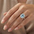 Cushion-Cut Blue Aquamarine and Diamond Halo Statement Ring On Hand