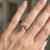 Triangular Cut Peach Pink Morganite Solitaire Engagement Ring On Hand