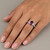 Purple-Pink Oval Sapphire and Diamond Engagement Ring On Hand