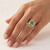 Oval Green Peridot and Diamond Halo Statement Engagement Ring On Hand
