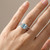 Cushion Aquamarine Twist Rope Halo Engagement Ring On Hand