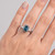 Emerald-Cut Fancy Blue Diamond 3-Stone Engagement Ring On Hand